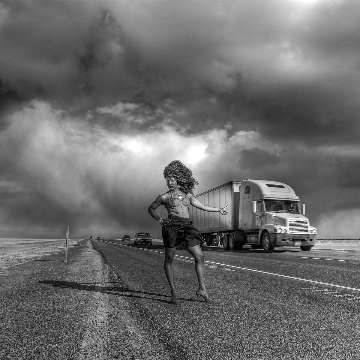 African American woman hitchhiking on I-15, Bonneville Salt Flats, Wendover, Nevada (Dan Morris)