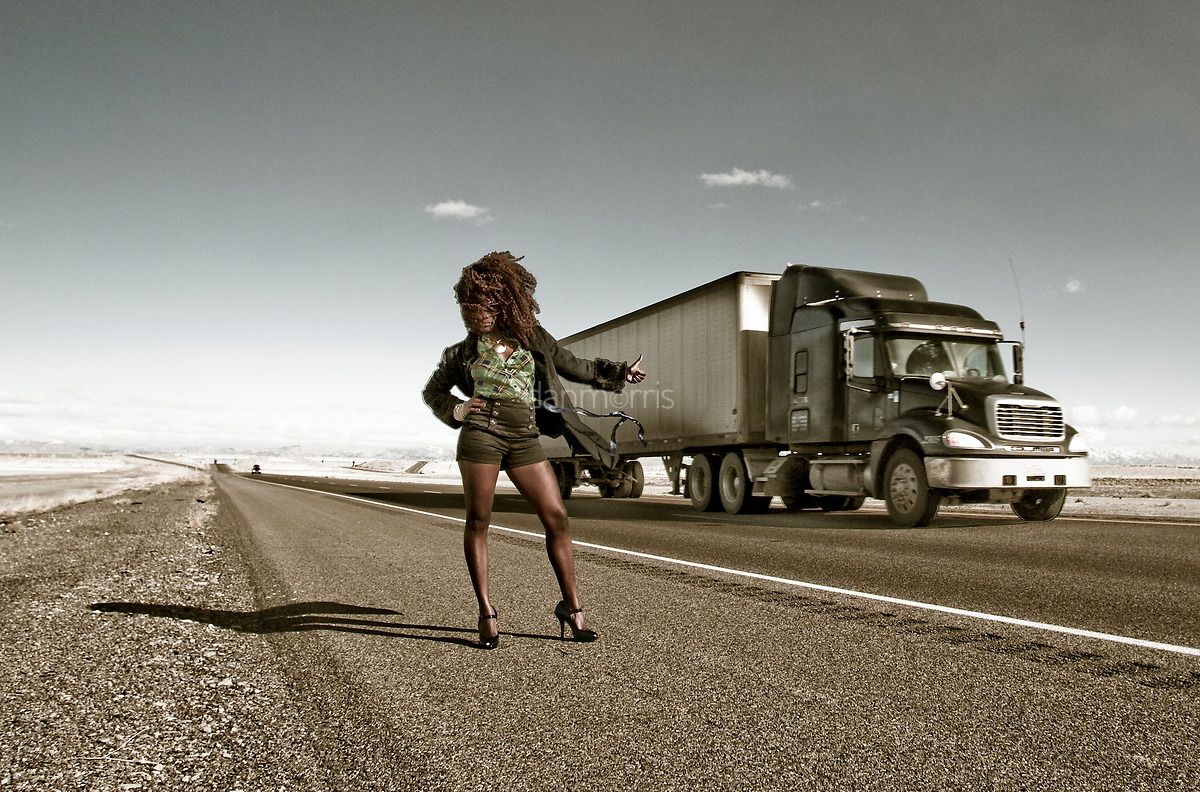 African American woman hitchhiking on I-15, Bonneville Salt Flats, Wendover, Nevada (Dan Morris)